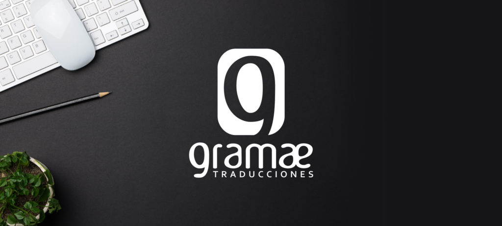 logo de gramae y mesa de agencia de traducciones